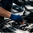 A technician checking an engine